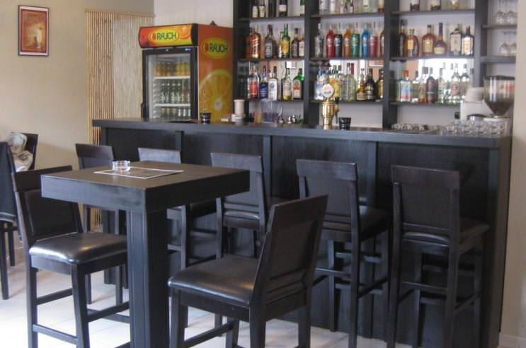 Black restaurant bar stools and tables